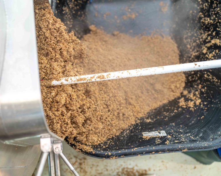 cleaning the boiler from residual malt after brewing beer in the brewery.